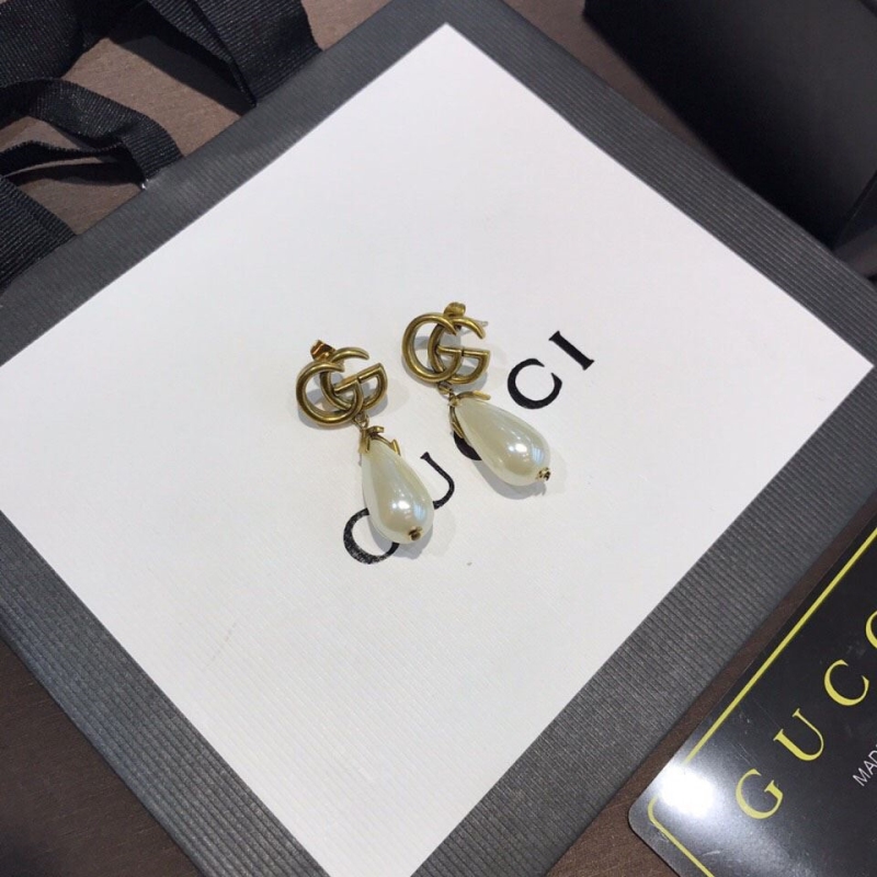 G*u*i earrings